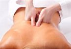 Massage of female back. Spa.
